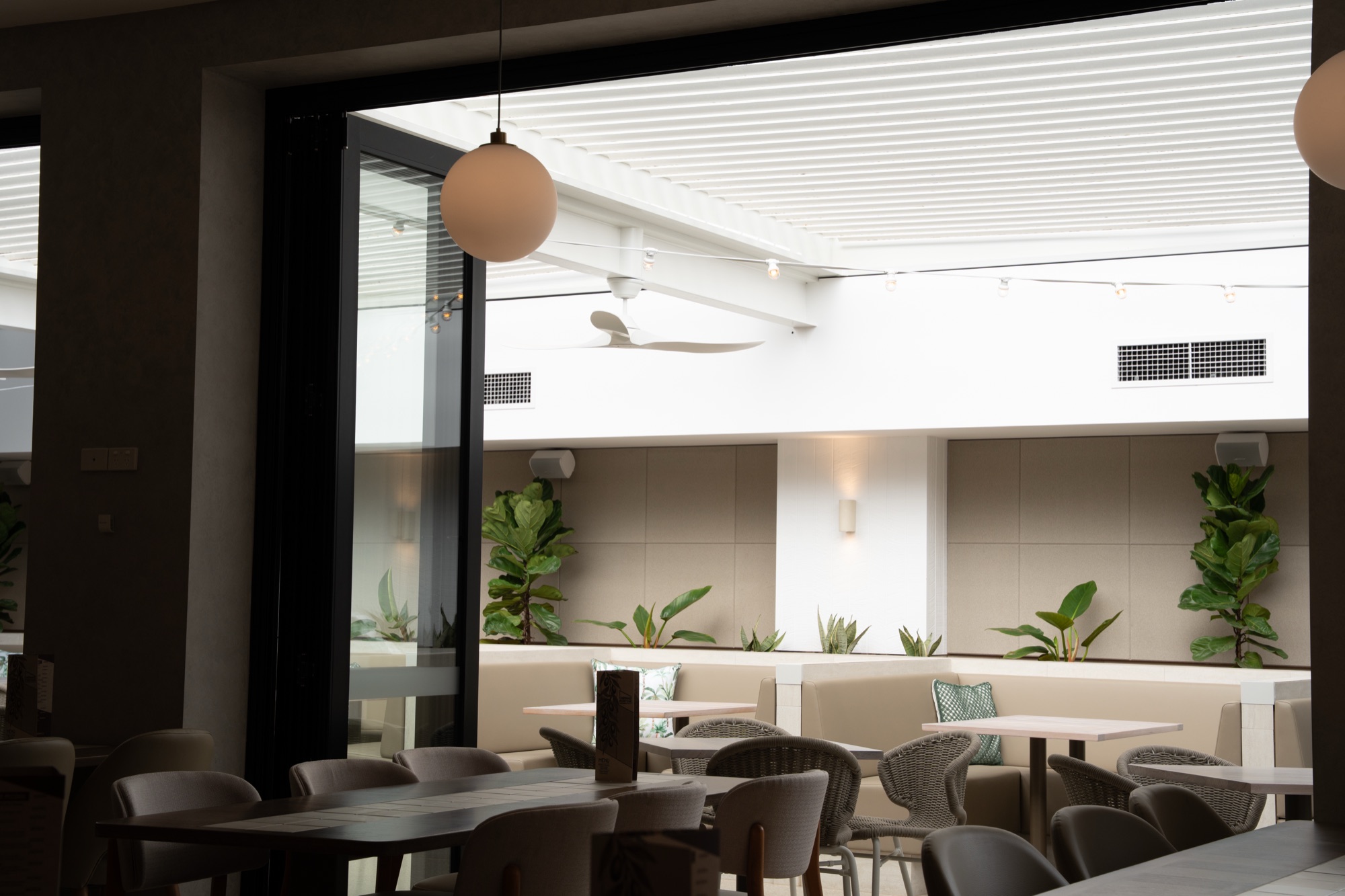 Louvre roof shading the games room terrace at Chipping Norton Hotel, Sydney South West