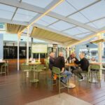 Thumbnail of Guests dining in the all-weather outdoor area at Good Nature Hotel