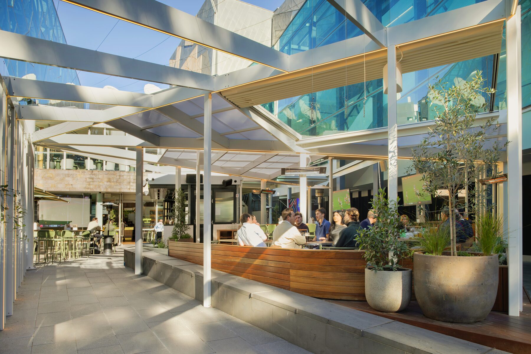 Interior bar beneath the custom aluminium roof structure at Good Nature