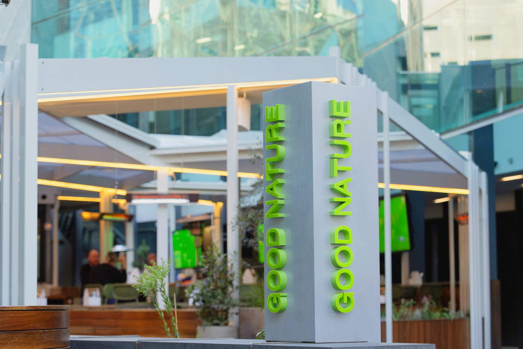 Good Nature Hotel signage beneath the retractable roof structure